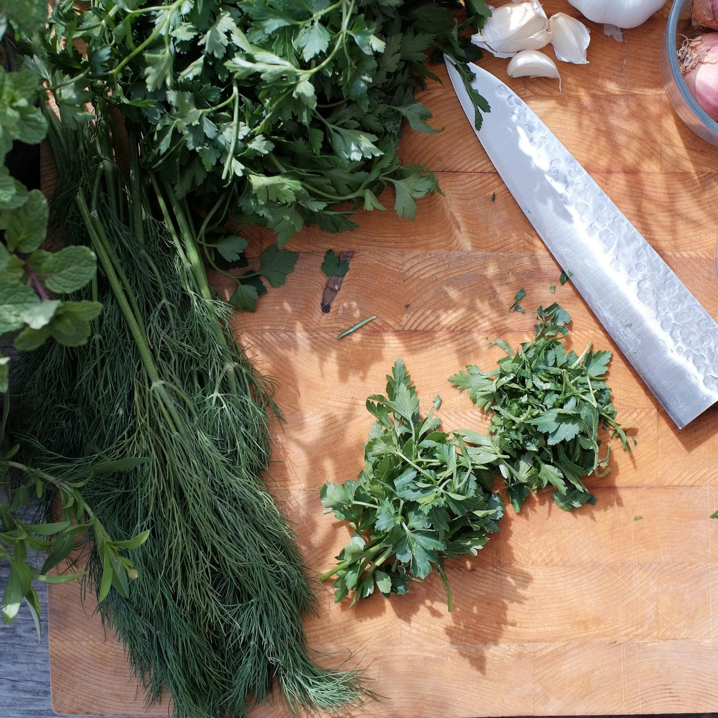 Community members collaborating in a modern kitchen space, sharing recipes and cooking techniques